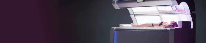 Distant view of a woman laying in an open sunbed