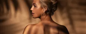 Side-by-side of a tanning bed and a red light therapy bed