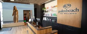 Palm Beach Tan and Wellness front counter with shelves of products.